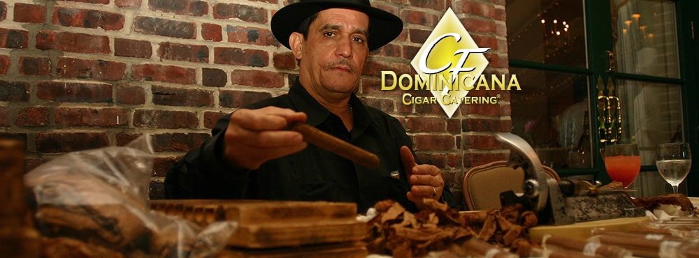 Cigar roller hand-rolling a cigar at a Philadelphia event